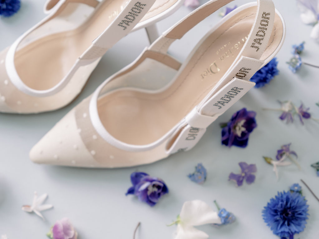 prestigiouswedding-wedding-flatlay-capucineatelierfloral-weddingshoes-dior-fineart